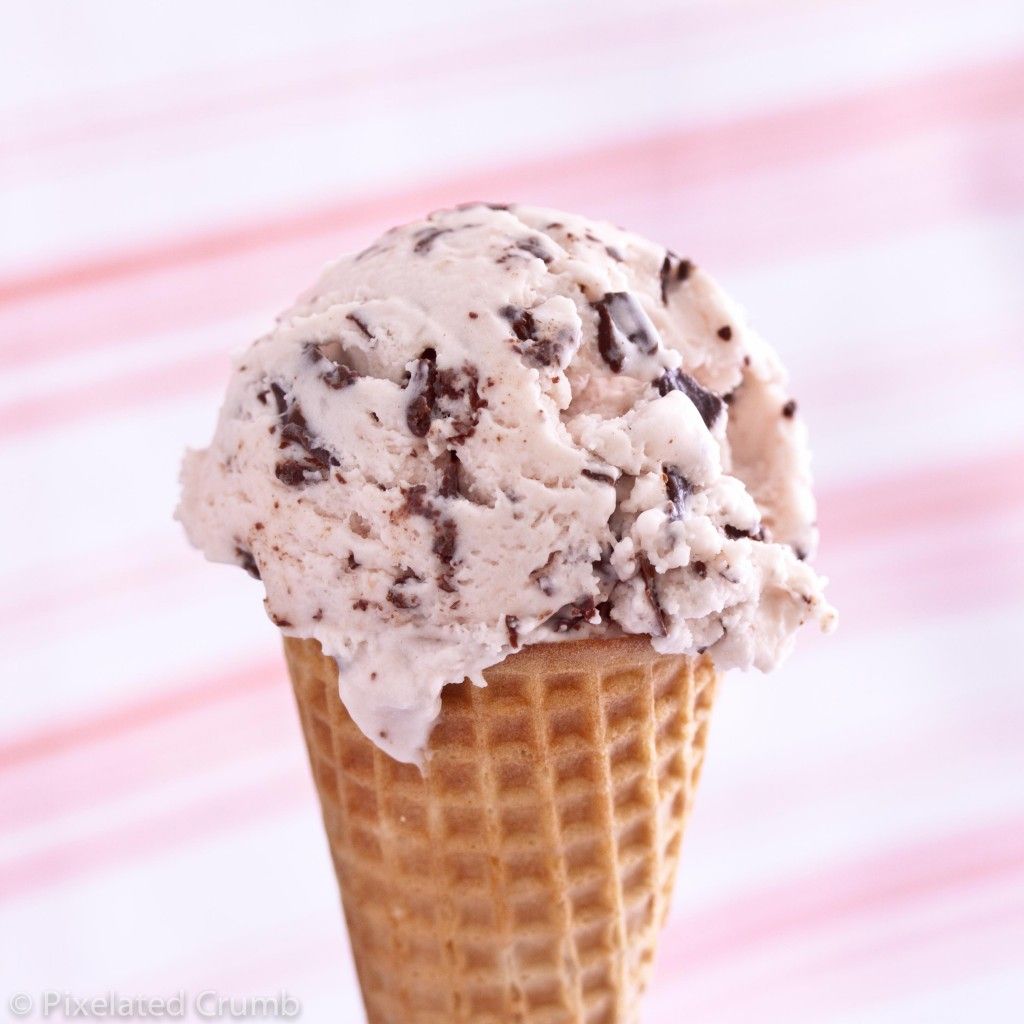 Stracciatella ice cream dish in a waffle cone with chocolate flakes